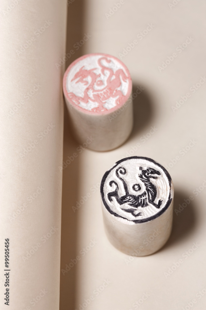 Close-up of Chinese dragon and white tiger stamps