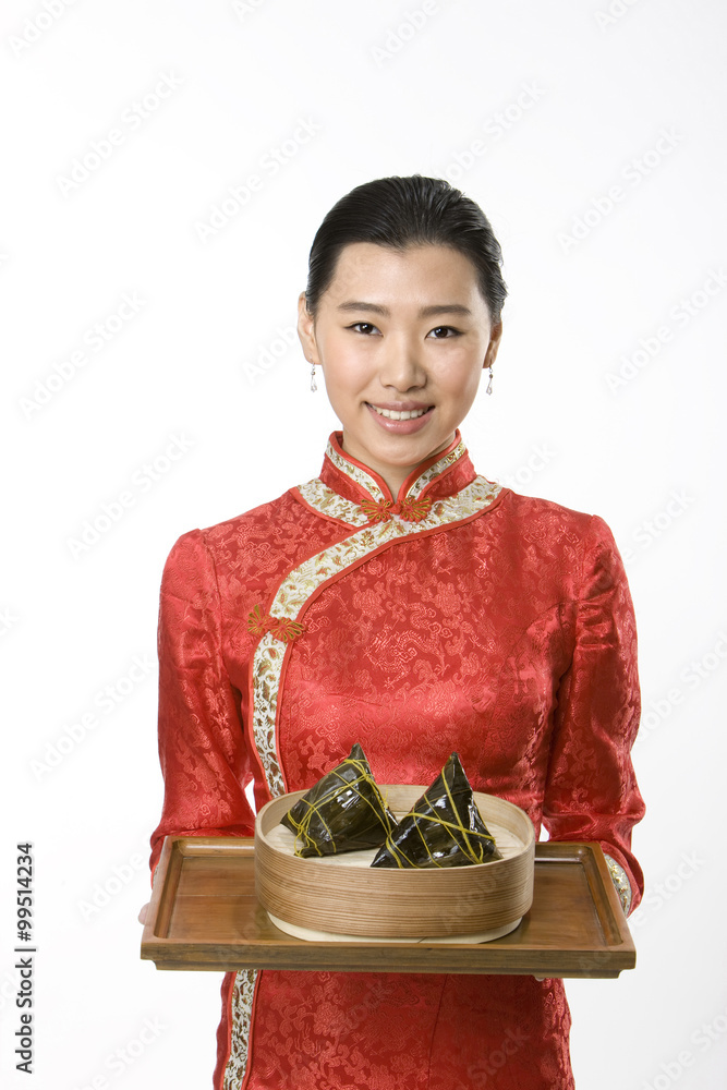 Server Carrying Leaf-Wrapped Dumnplings