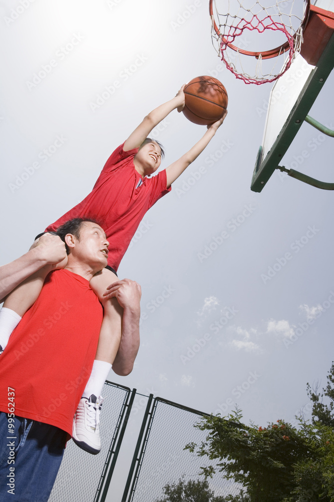 Father And Son Playing Basketball