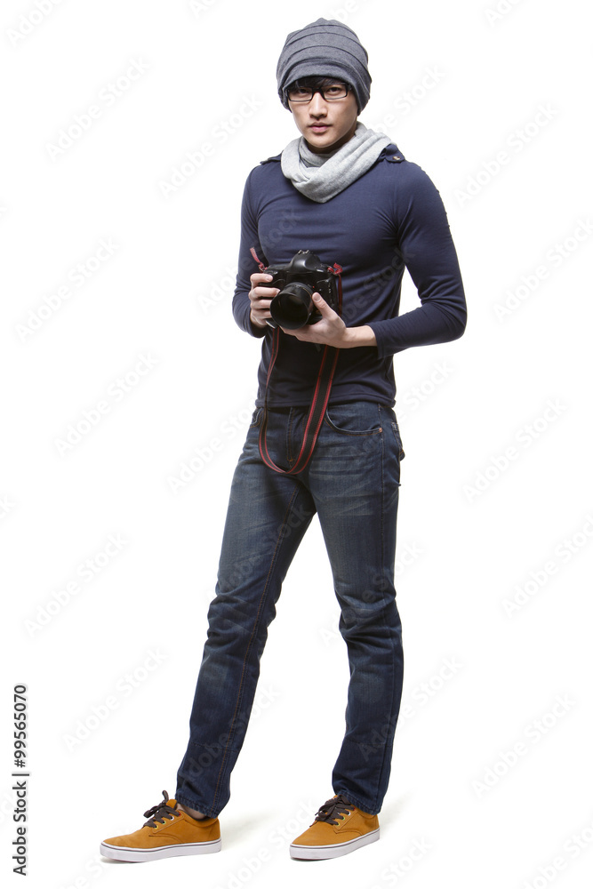 Cool young photographer with camera