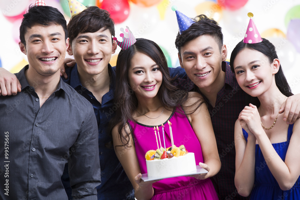 Young adults having a birthday party