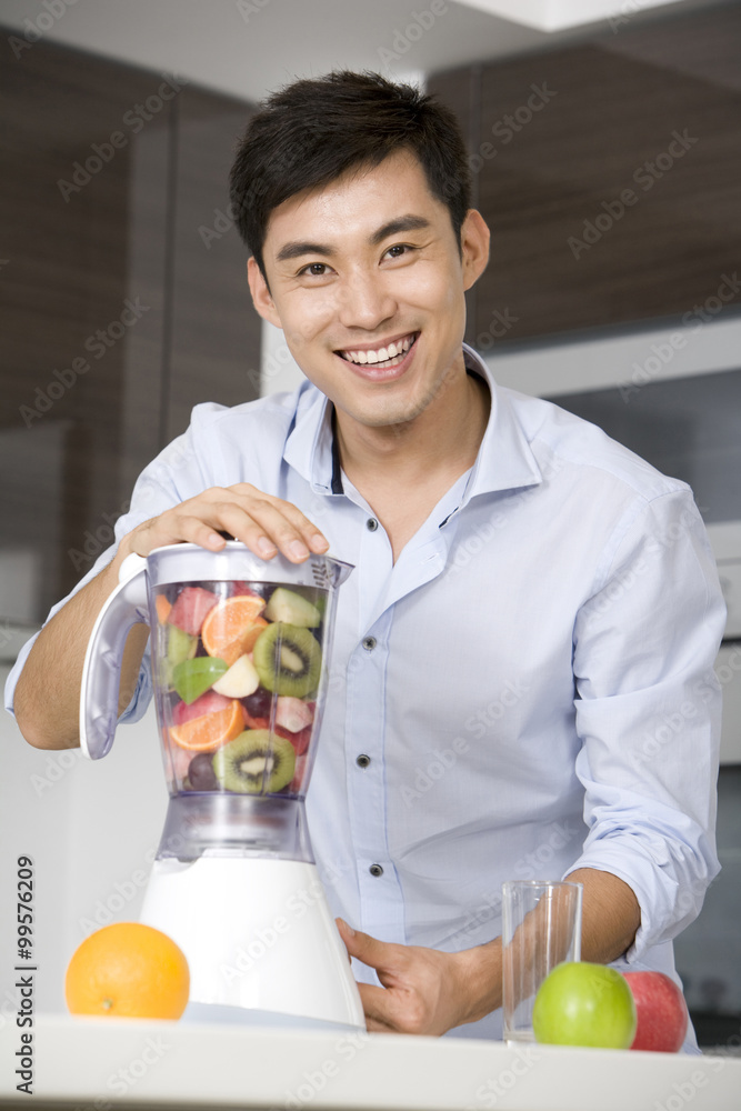 Man making fresh fruit juice