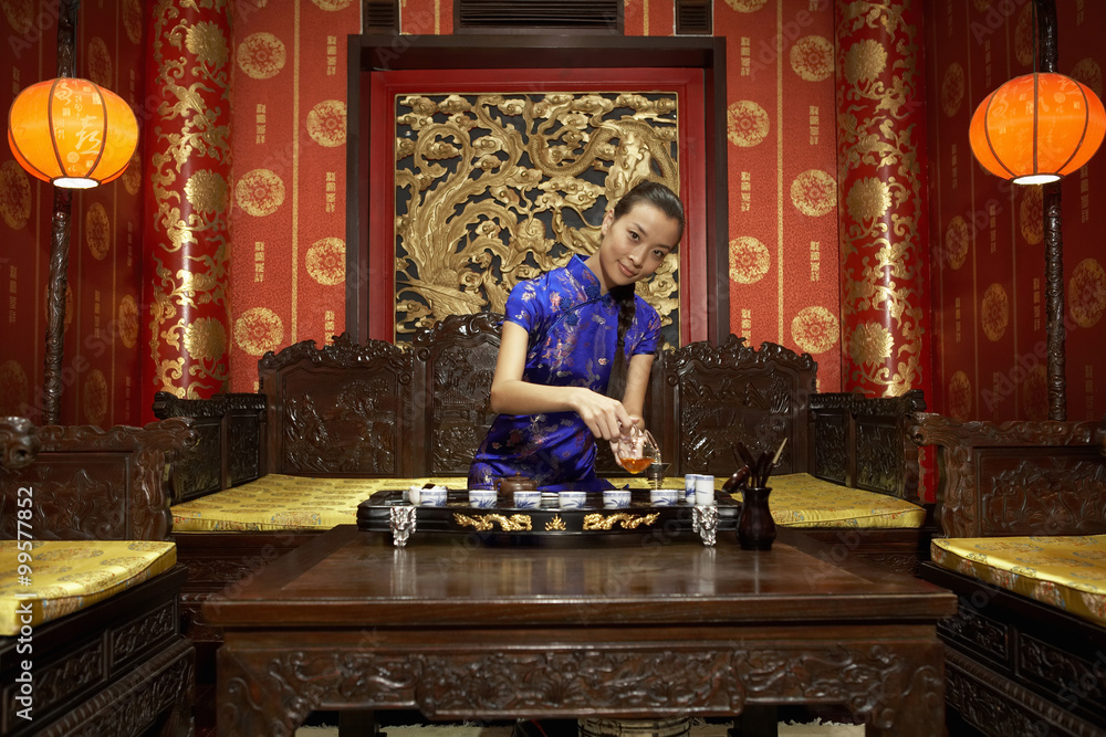 Young Woman Performing Traditional Tea Ceremony