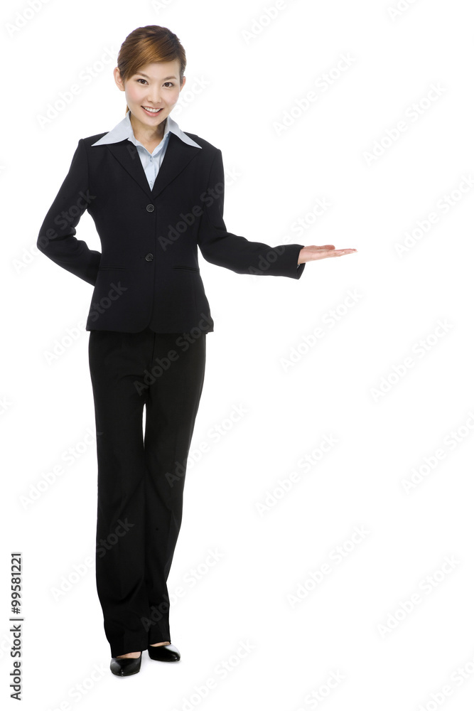 Young businesswoman making a welcoming gesture