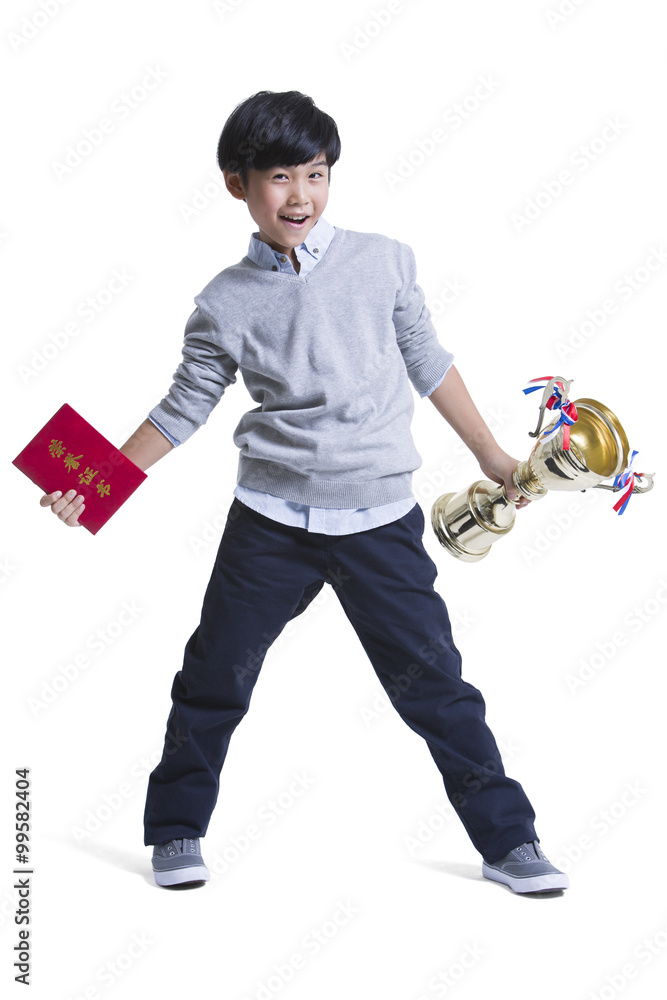 Cheerful boy with certificate and trophy