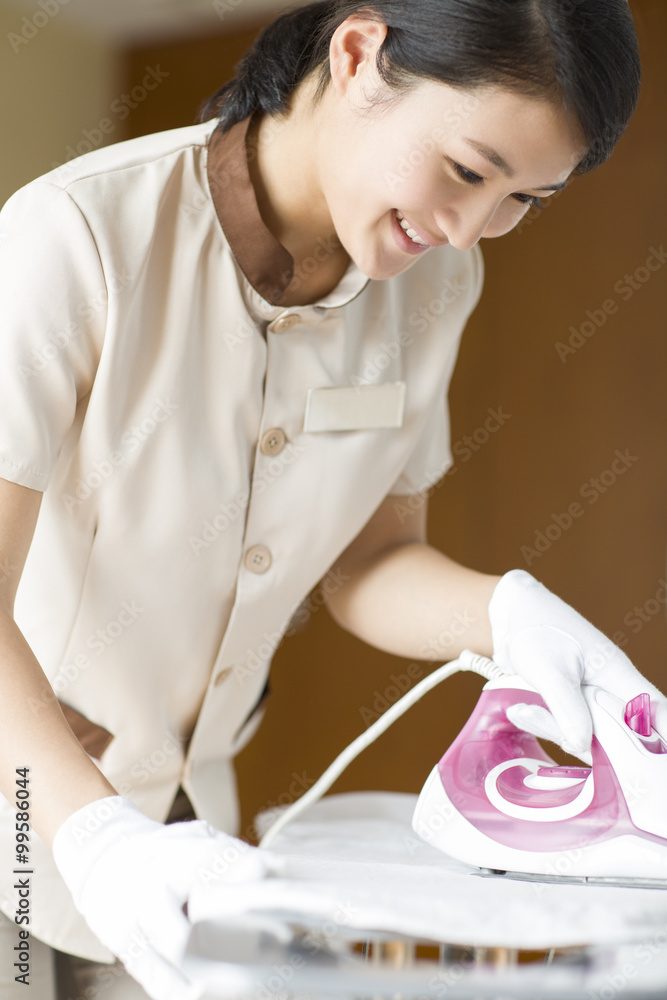 Domestic staff ironing
