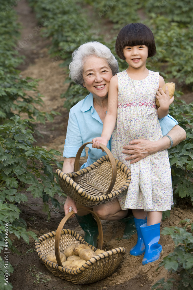 Grandma and granddaughter gardening