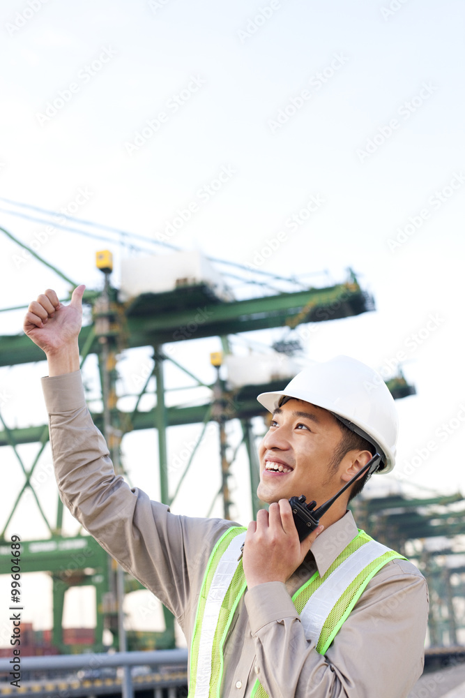 shipping industry worker giving the thumbs-up signal