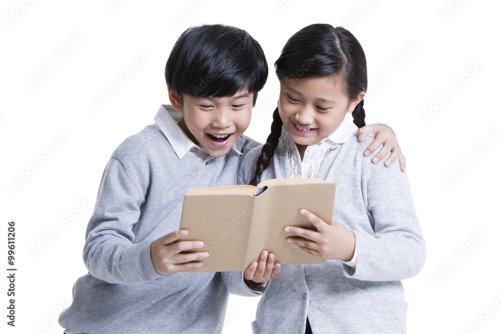 Cute boy and girl reading