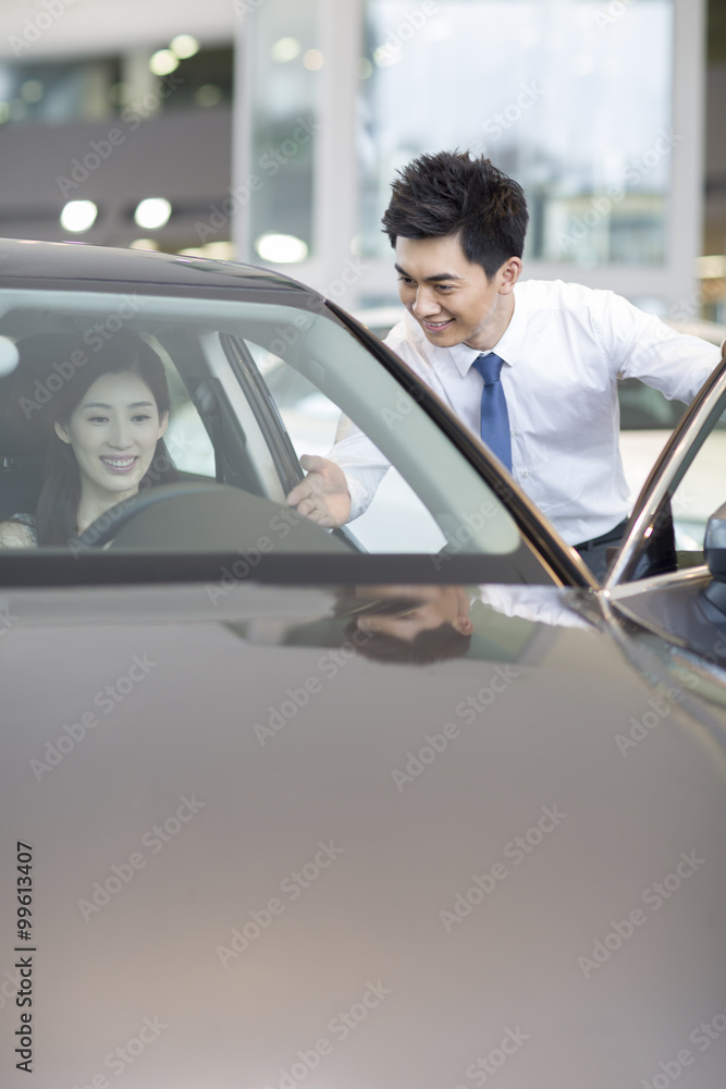 Young woman taking a test drive