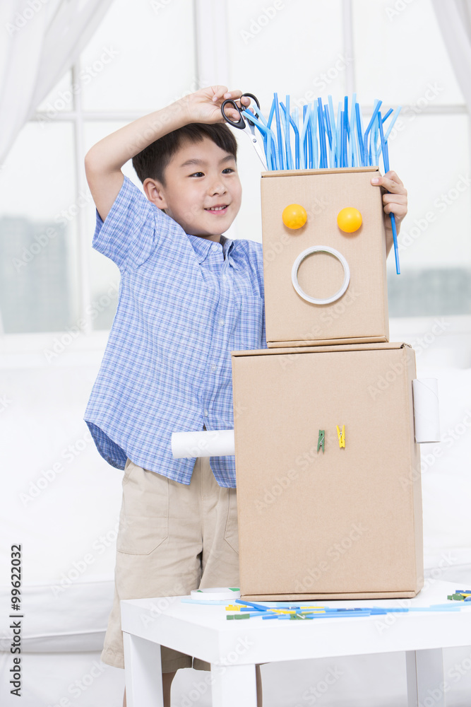 Boy making a toy robot
