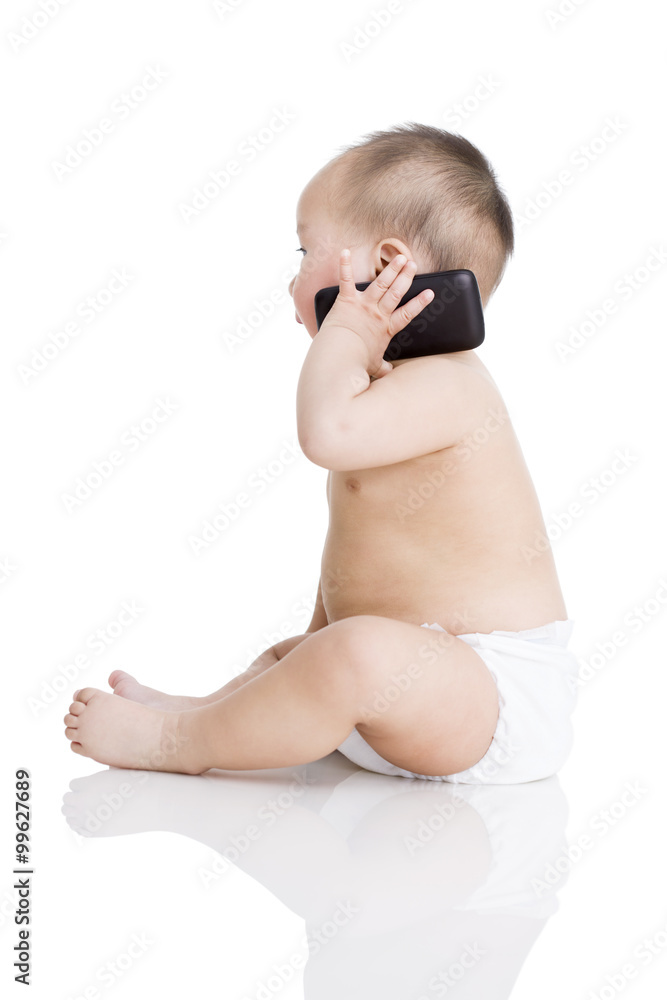 Cute baby boy on the phone