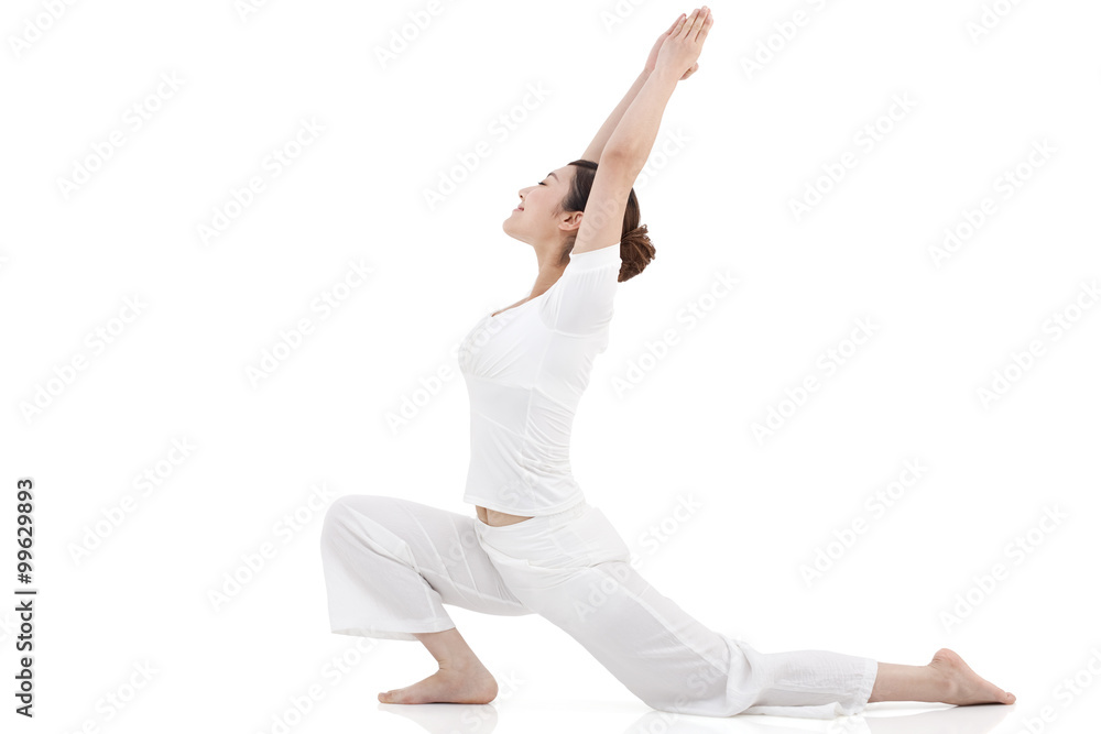 Young woman stretching and practicing yoga
