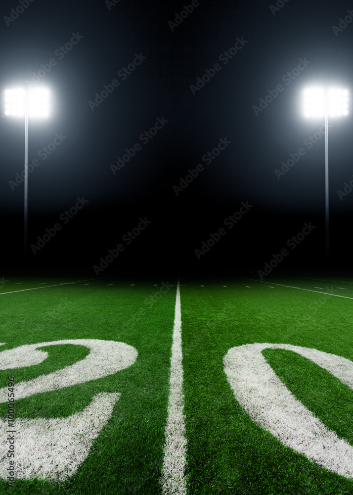 Football field illuminated by stadium lights