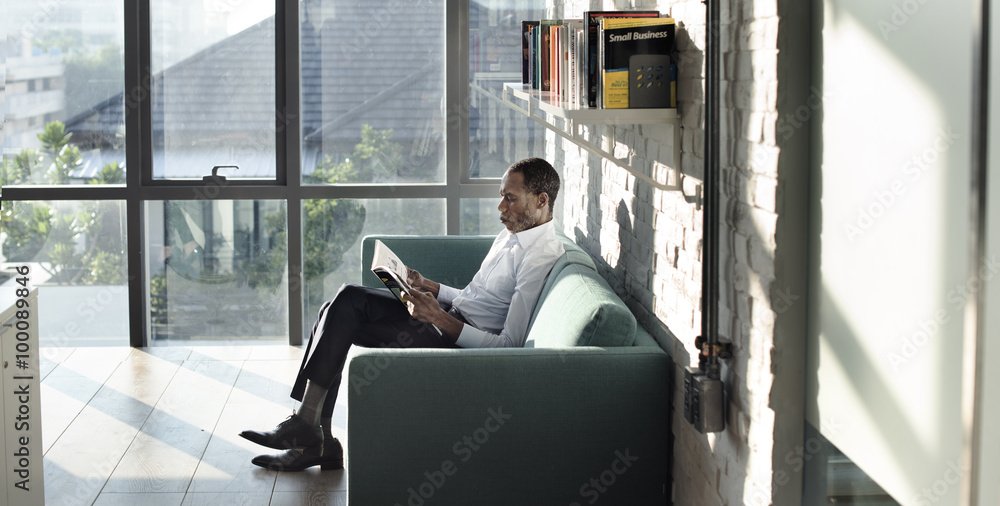 Businessman Reading Magazine Relaxation Concept