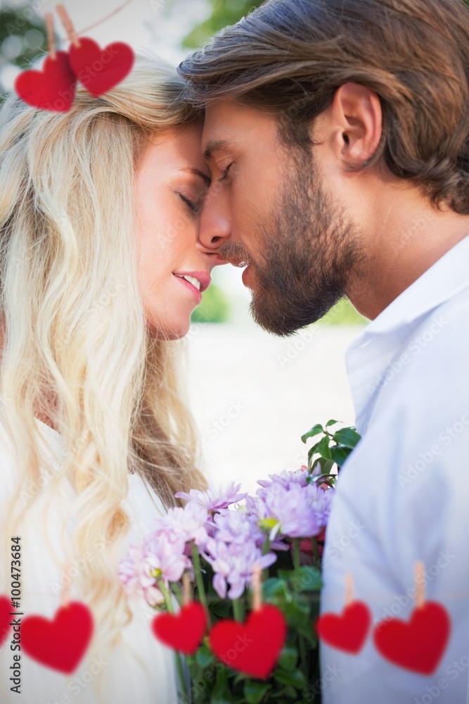 Composite image of attractive couple about to kiss each other