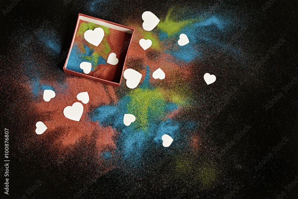 colored sand and white hearts
