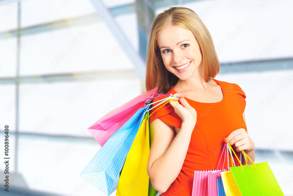 happy woman with bag on a shopping in mall