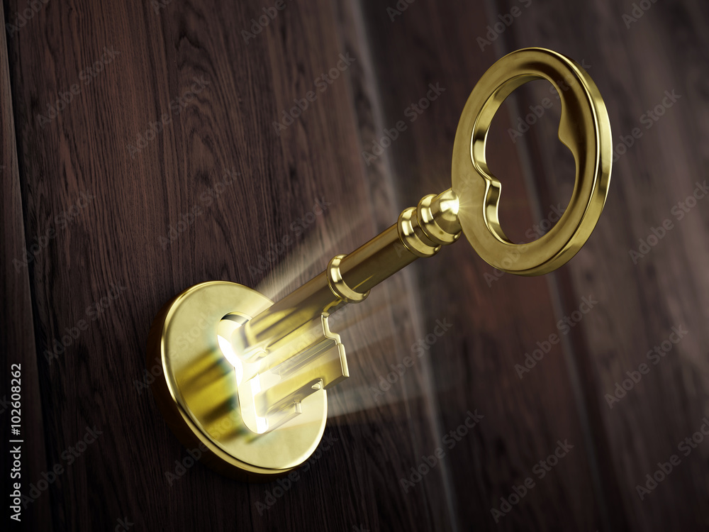 Golden key moving in keyhole