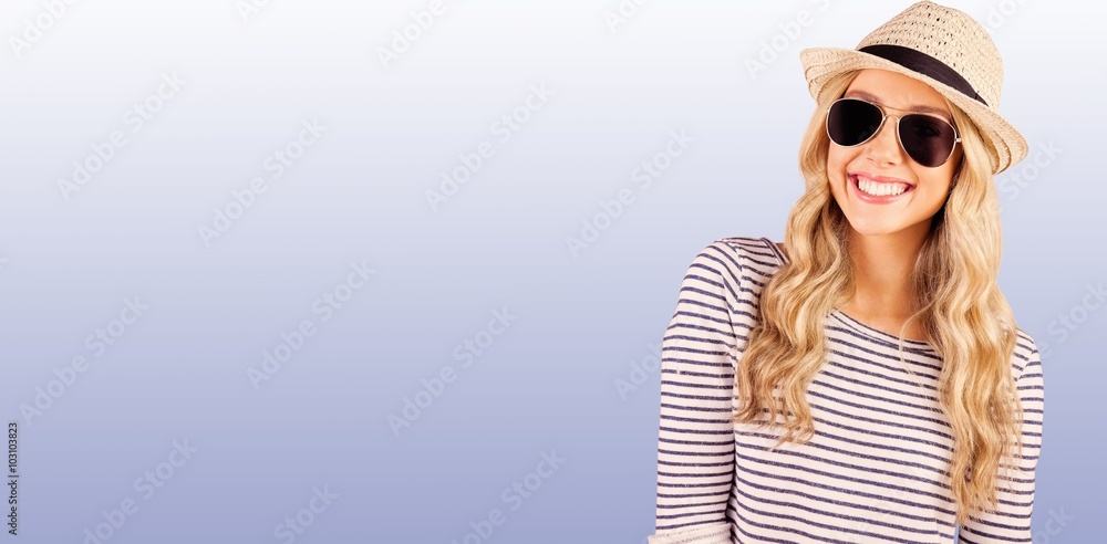 Composite image of gorgeous smiling blonde hipster with sunglasses