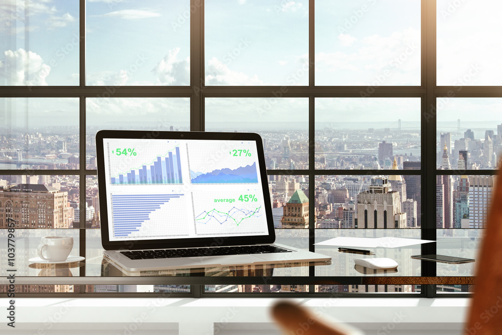 现代玻璃桌上笔记本电脑屏幕上的财务统计数据