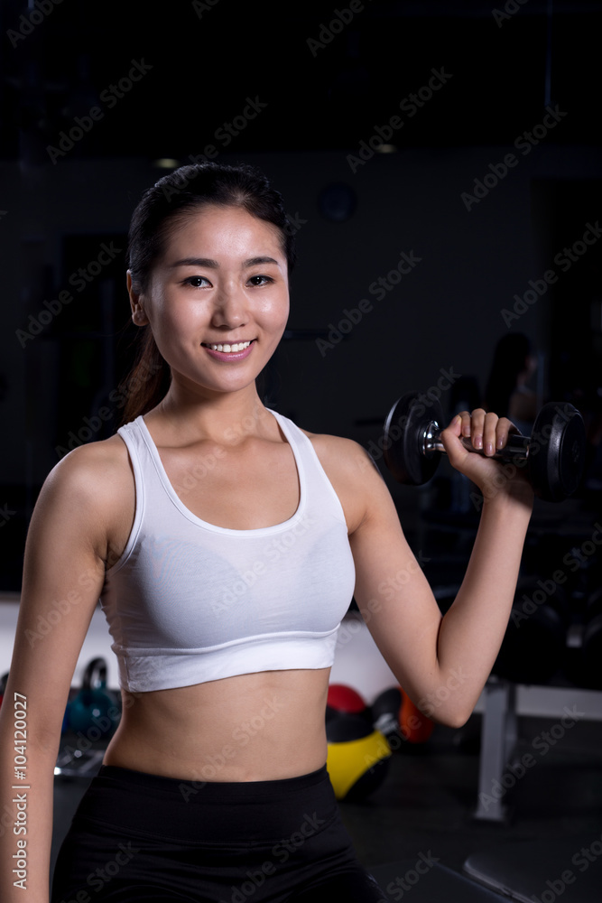 beautiful girl working out in moder gym