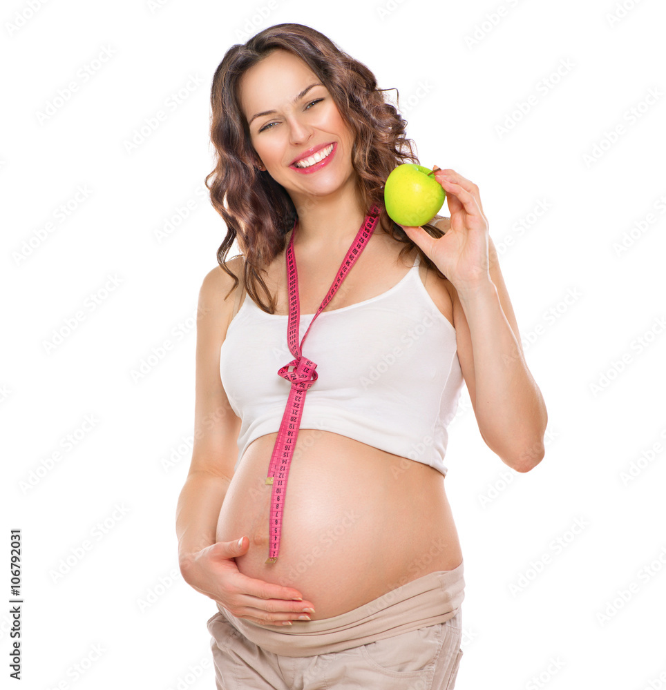 孕妇测量大肚子，吃苹果。健康食品