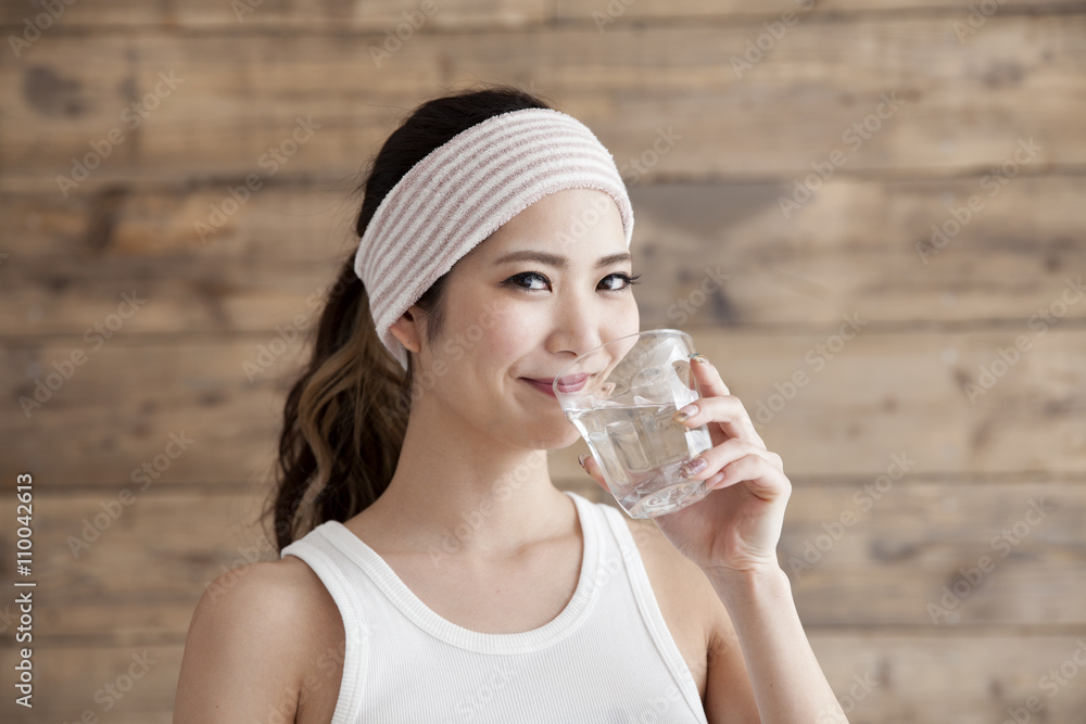 Young women are drinking delicious water