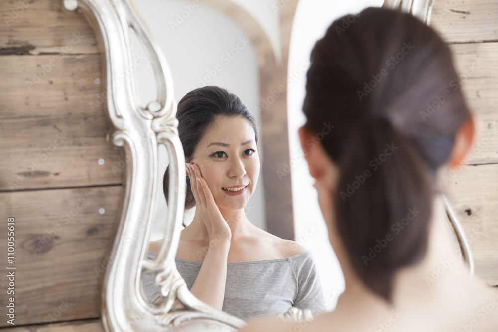 Women have to check the skin look in the mirror