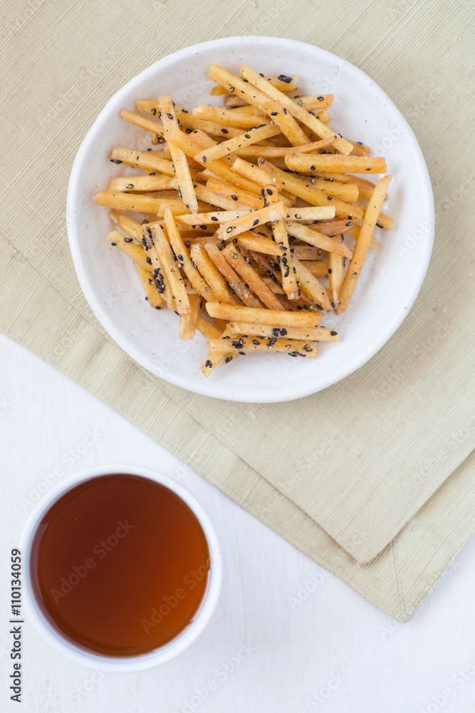 Brown Sugar - Glazed sweet potato fries with black sesame