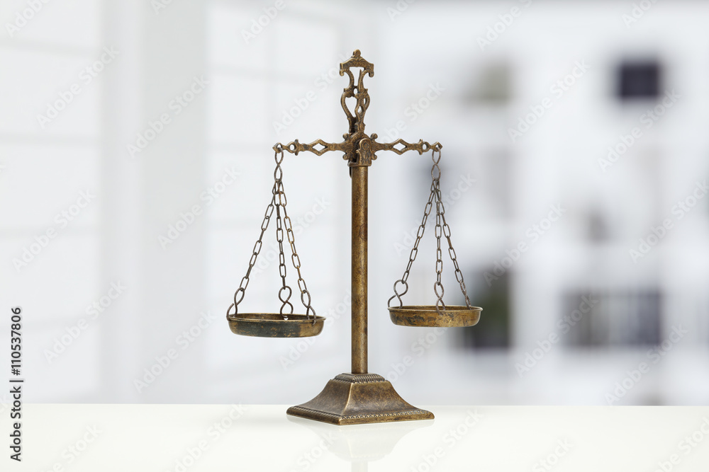 Justice Scale on white table