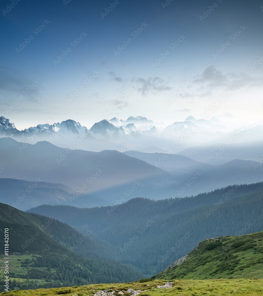 Hills during sunrise in mountain valley. Beautisul natural landscape