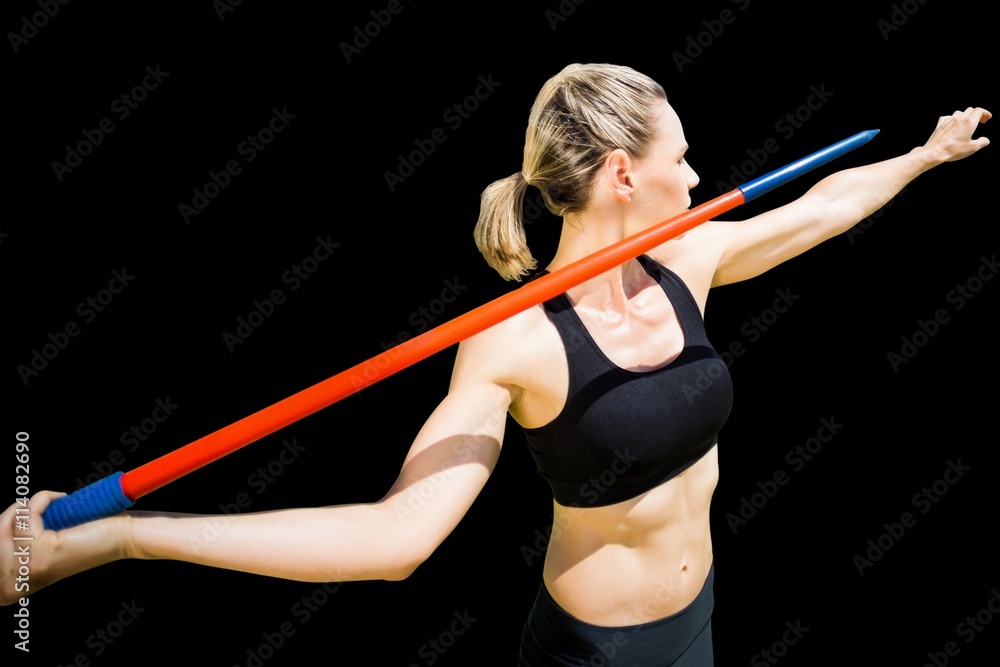 Composite image of sportswoman preparing to javelin throw 