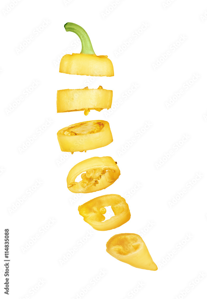 Sliced in pieces yellow pepper isolated over white background