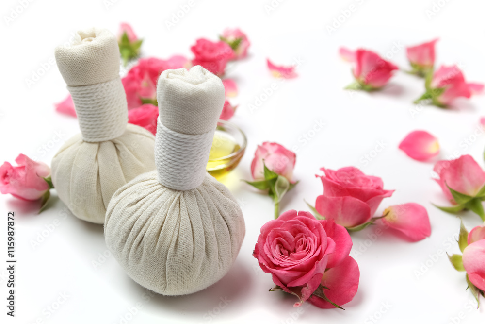 Herbal compress balls for spa treatment with rose flower