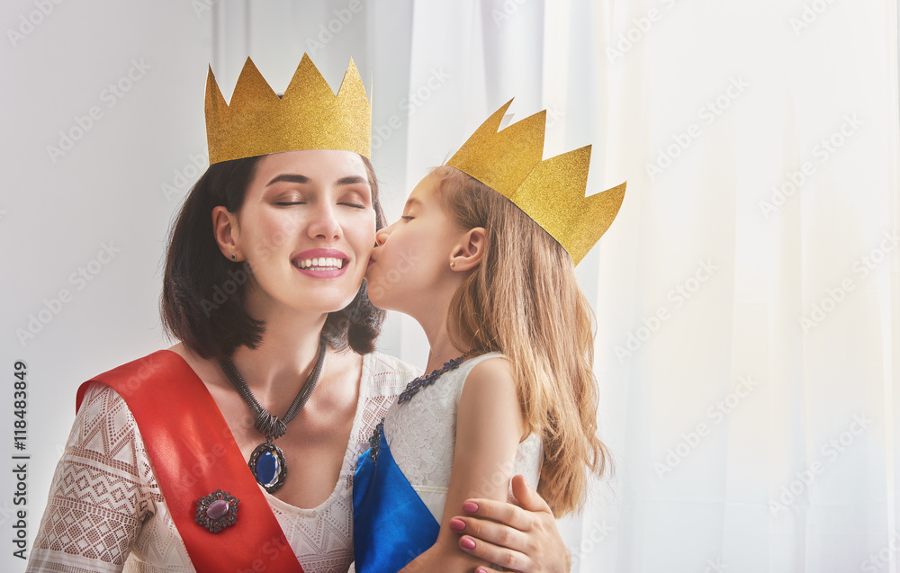 queen and princess in gold crowns