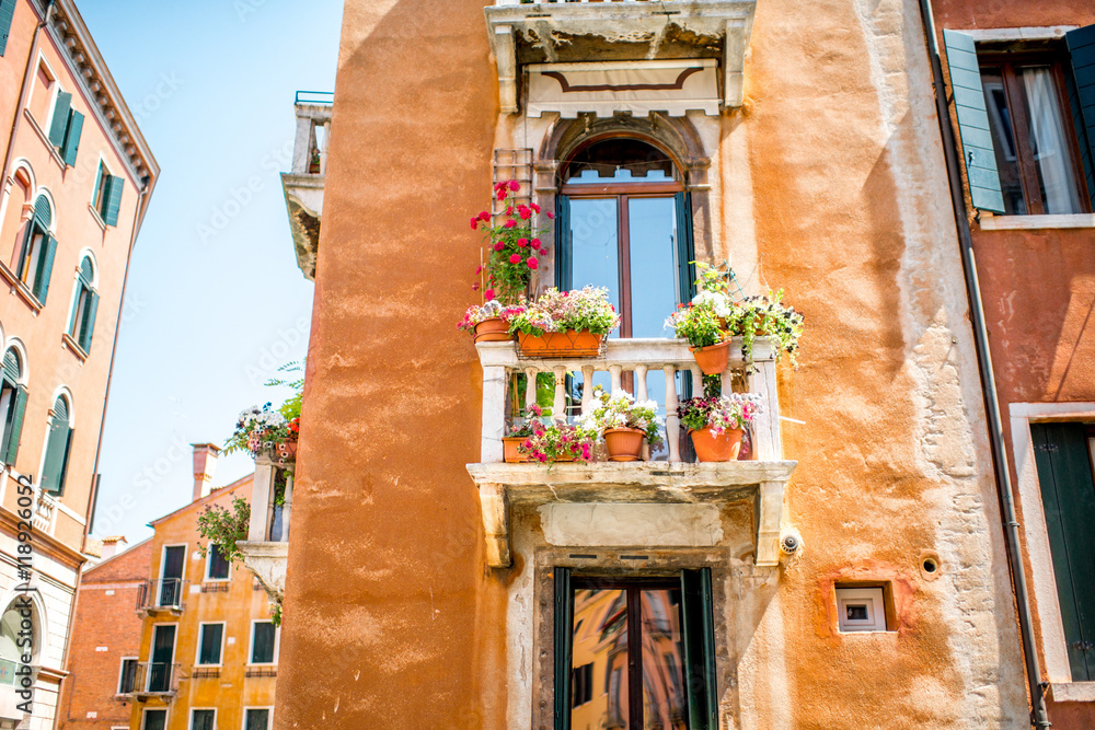 Old gothic house facade with beautiful balcony in Venice
