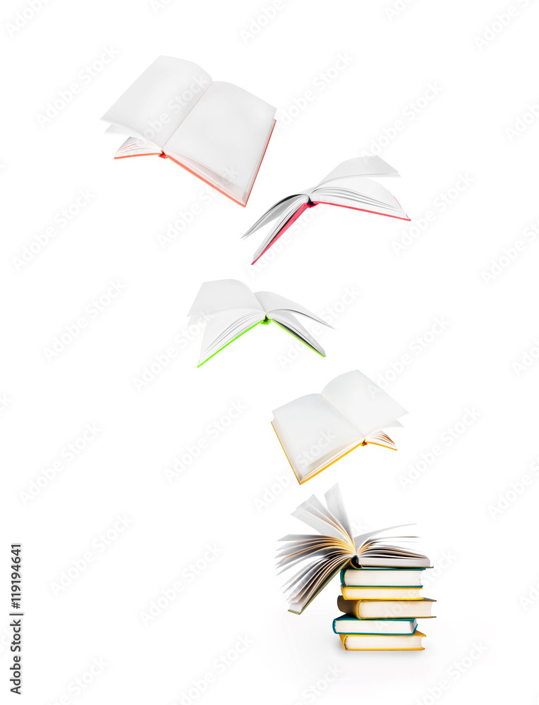 白色隔离的一叠书和飞行书籍