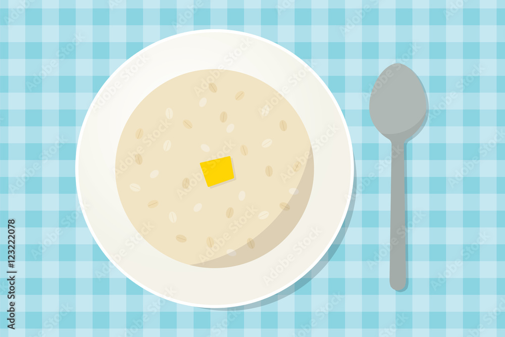燕麦粥，用勺子在盘子里放一块黄油。健康早餐