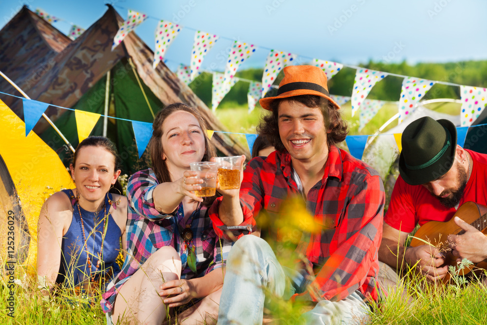 Young people drinking at summer festival