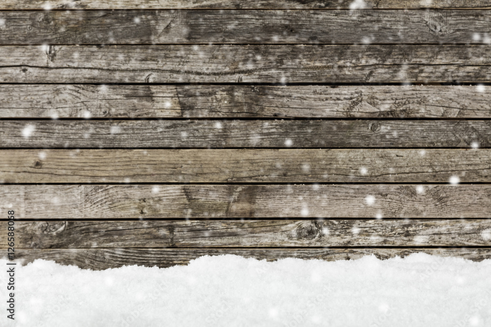 木栅栏上的雪作为背景图像