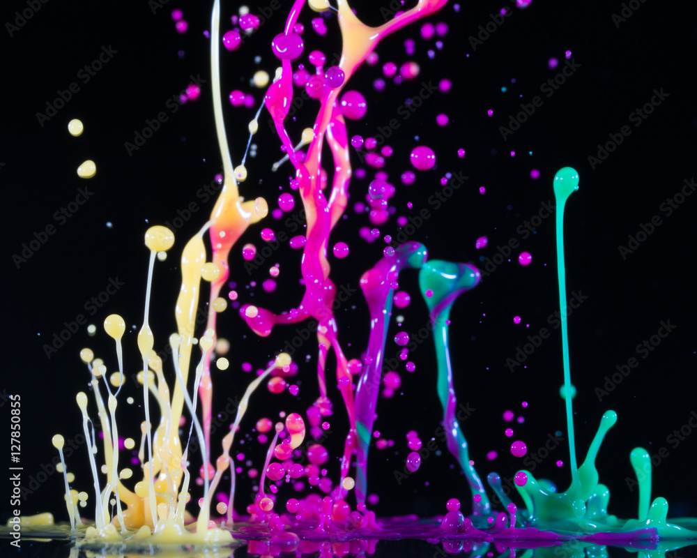 Аbstract sculptures of colorful splashes of paint. Dancing liquid on a black background. Ink water s