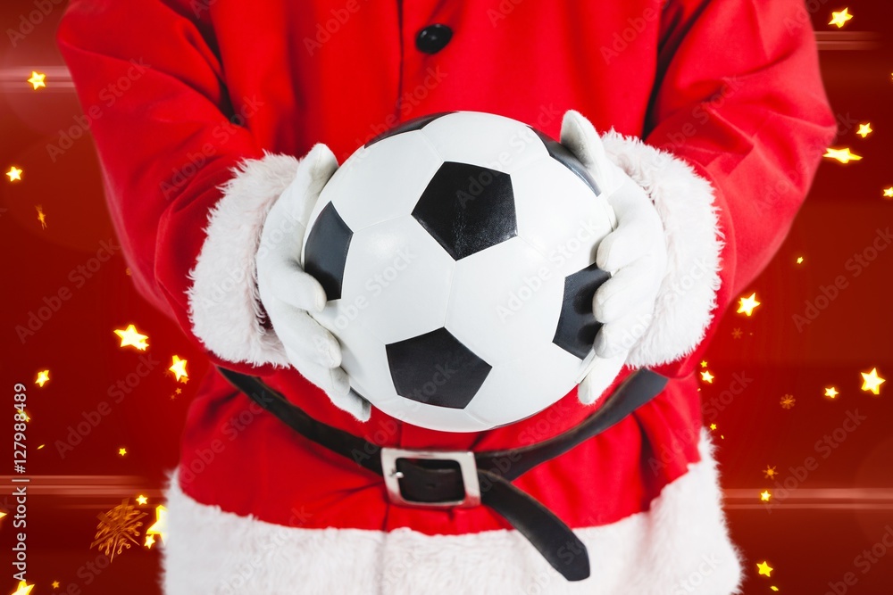 圣诞老人拿着足球的合成图像