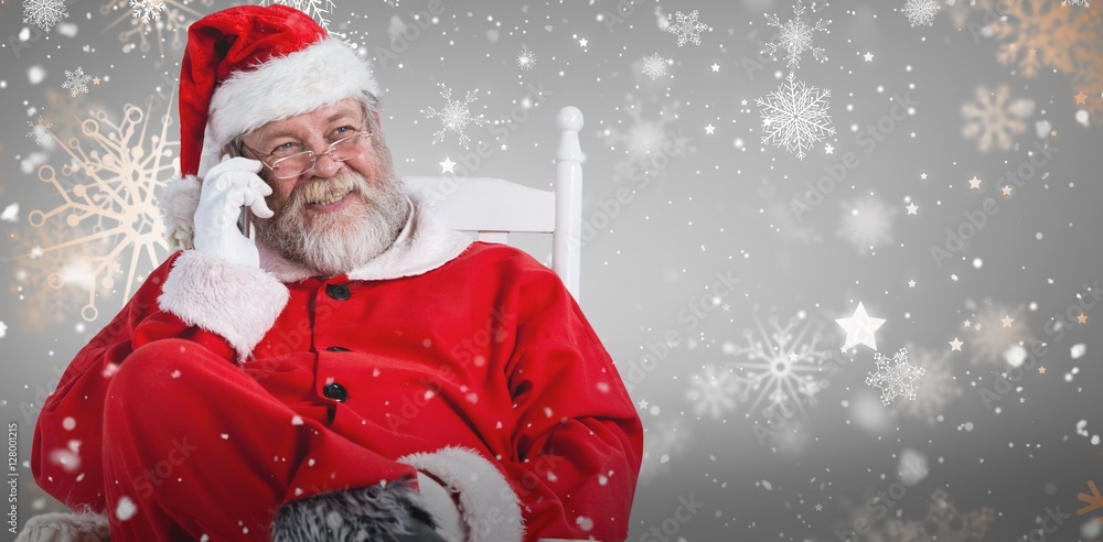 圣诞老人在椅子上使用手机的合成图像