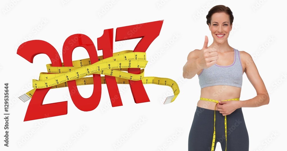 Composite image of fit woman measuring waist while gesturing thu