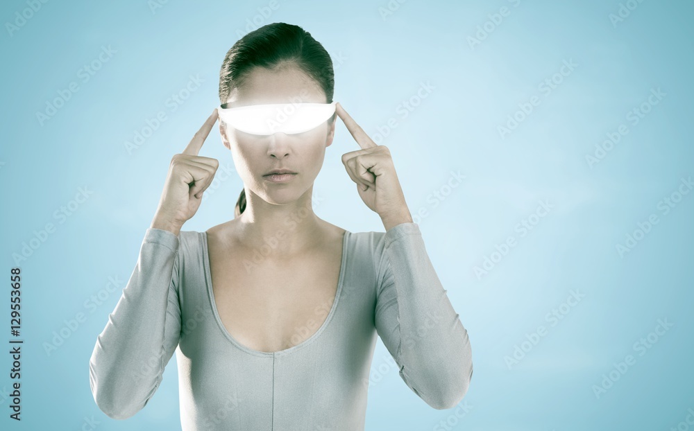Composite image of woman using virtual video glasses