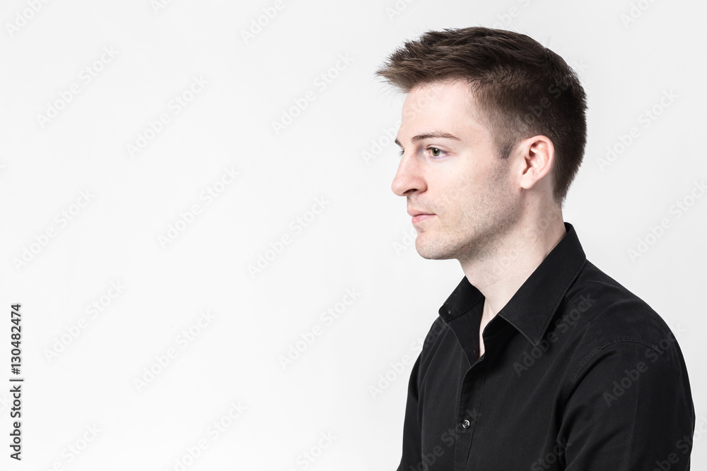 Side profile of handsome caucasian businessman with black shirt