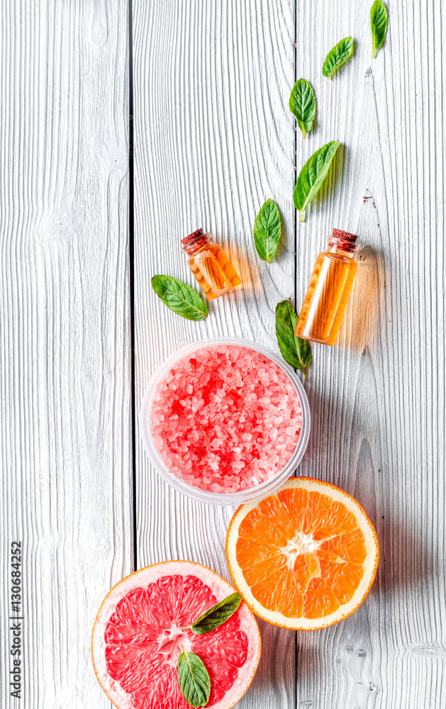 organic cosmetic with citrus on wooden background top view