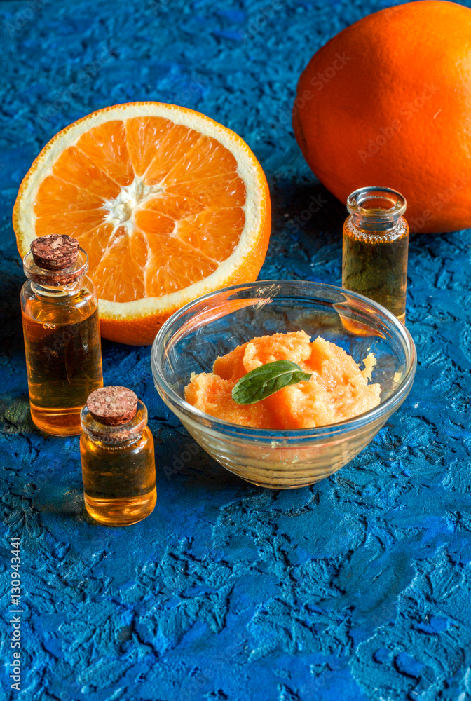 organic cosmetic with citrus on blue background