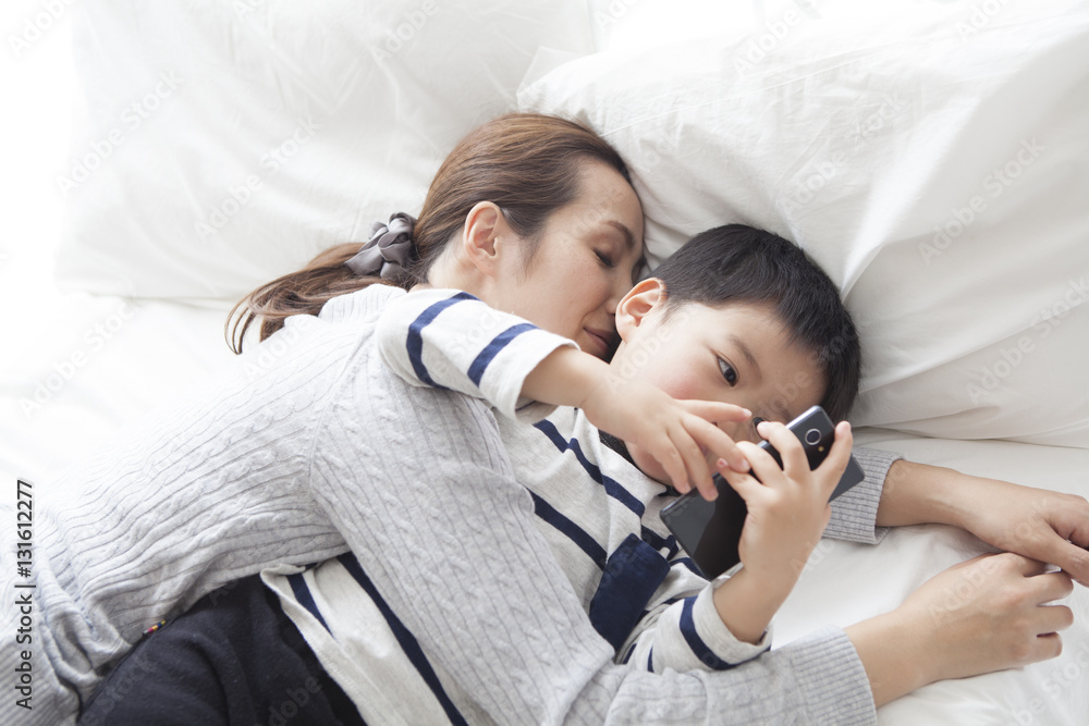 My mother sleeps and my son is watching smartphone